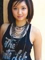 Brenda wearing necklaces and a tank top